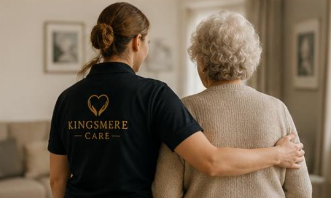 Carer walking with an older person at home
